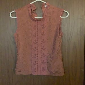 Fancy pink laced blouse. Very nice for special occasions and is comfy.